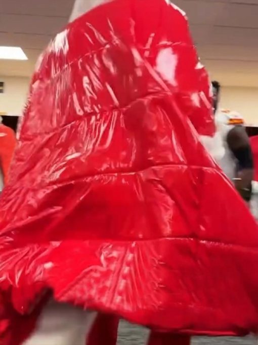 Red raincoat worn by a person in an indoor setting