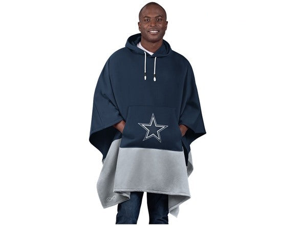 Person wearing a navy blue and gray poncho with a star design on a white background