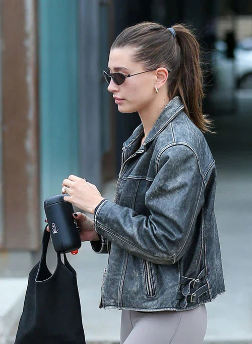Hailey Baldwin Bieber's edgy outfit featuring a cropped leather jacket and skinny jeans in German style