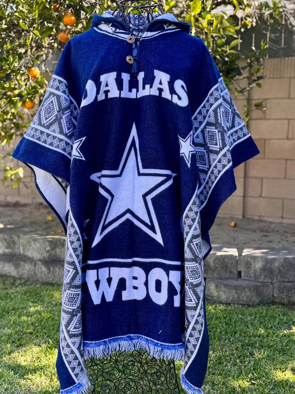 Blue and white poncho with 'Dallas Cowboys' logo on a grassy background