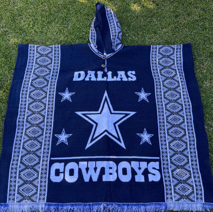 Dallas Cowboys poncho with star design on grass