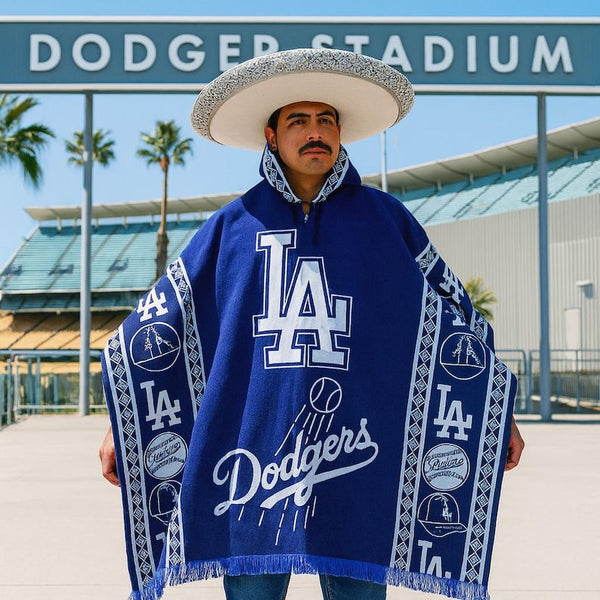 Person wearing a blue Los Angeles Dodgers poncho with a sombrero at Dodger Stadium.