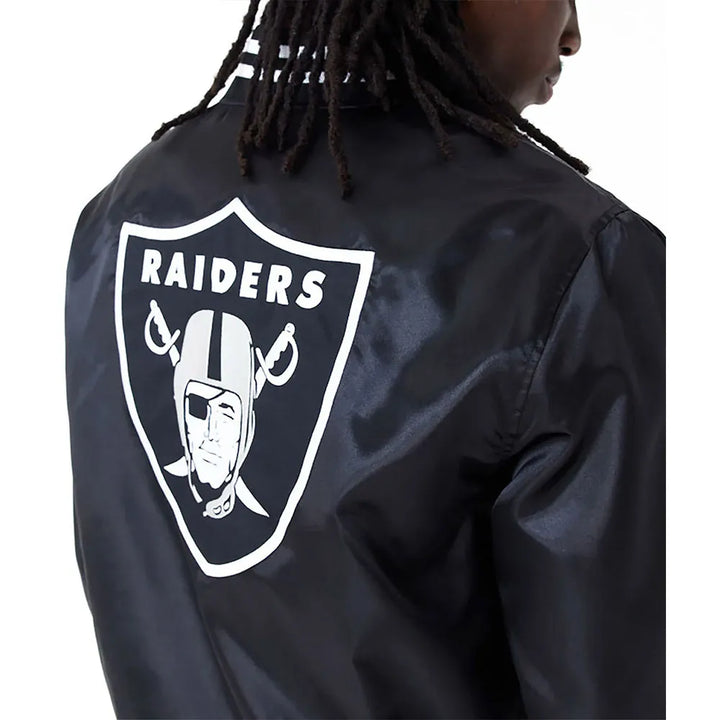 Black satin bomber jacket featuring Las Vegas Raiders branding in USA