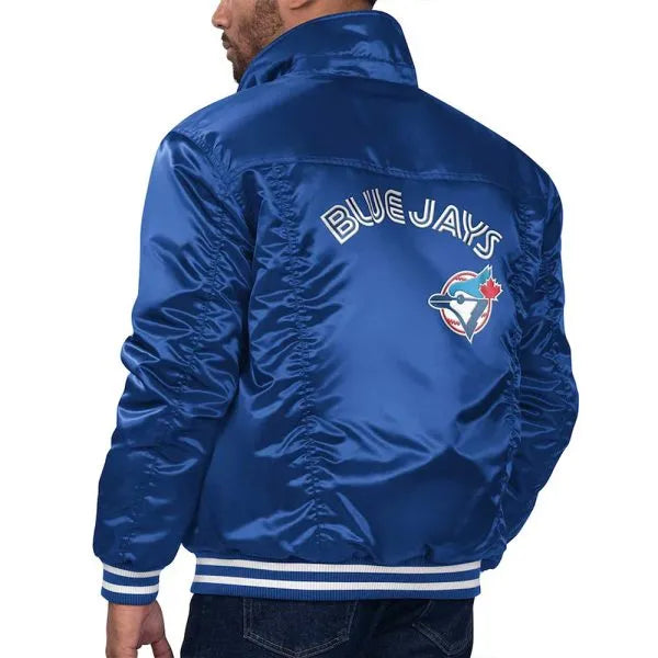 Blue jacket with 'Blue Jays' logo on the back, worn by a person.